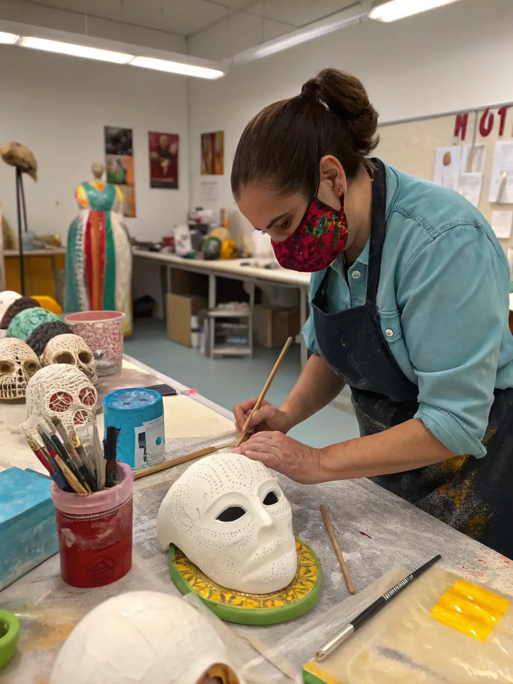 A photograph capturing a workshop session where participants are actively engaged in creating Venetian masks, showcasing the hands-on artistic experience.